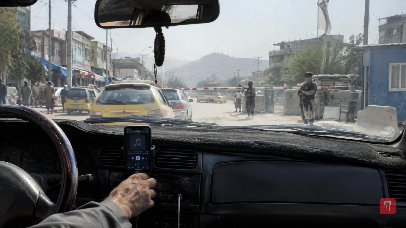 Despite Taliban music ban, Afghan taxi drivers cut songs at checkpoints, resume after